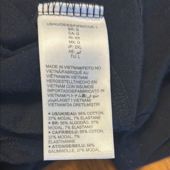 Women large Amazon tops in white and black. One top has a wider neckline. - Picture 12 of 14